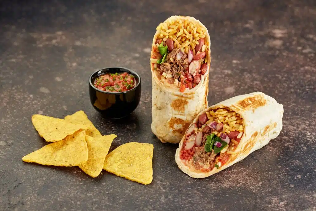 Carne Asada Super Burrito with chips and salsa from Esmeralda&rsquo;s 2.0 in Eureka CA &mdash; packed with grilled steak, rice, beans, cheese, and fresh toppings. Part of the Buy 1 Get 1 Free Burrito Lunch Special loved across Humboldt County for authentic Mexican flavor.