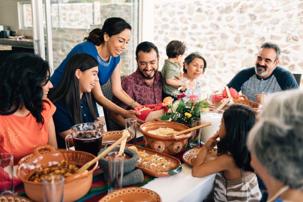 Family Enjoying EBT Relief Meal at Esmeralda’s Eureka CA A smiling family seated around a table at Esmeralda’s 2.0 in Eureka, CA, enjoying an EBT-friendly comfort meal with tacos, rice, beans, and aguas frescas during the local SNAP delay—offering dignity and warmth to Humboldt County families.