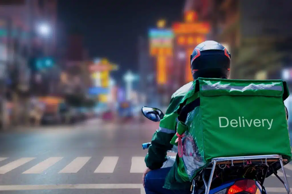 At Street Food in night city, Thailand, delivery drivers are making deliveries to consumers who have placed online orders Home